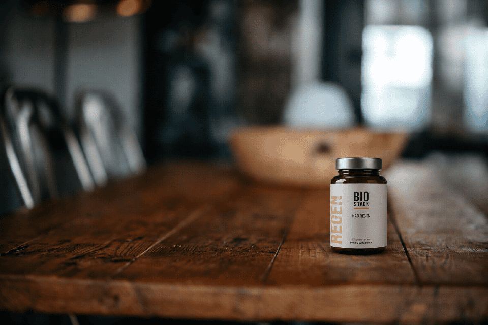NAD Regen bottle on a wooden table